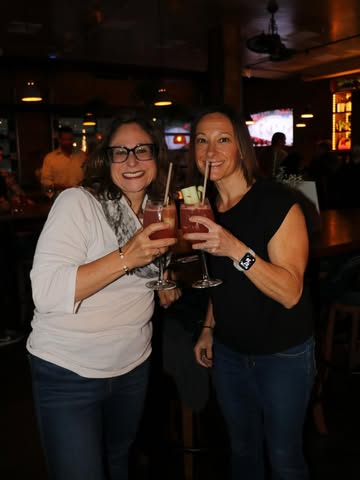 Cocktails for a Cause Event, Two ladies cheers with their cocktails