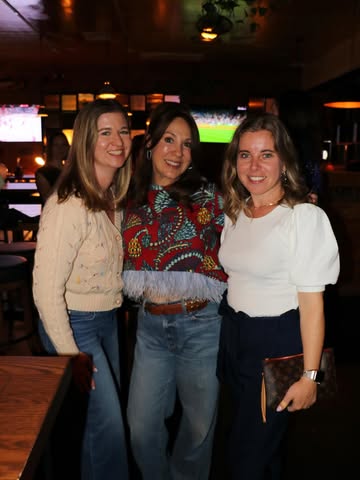Cocktails for a Cause event — three ladies smiling for the camera