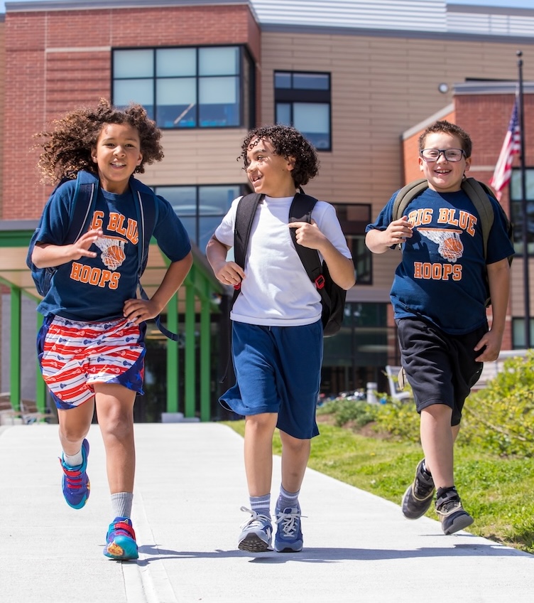 three-boys-walking-in-front-of-elementary-school-swampscott three-boys-walking-in-front-of-elementary-school-swampscott